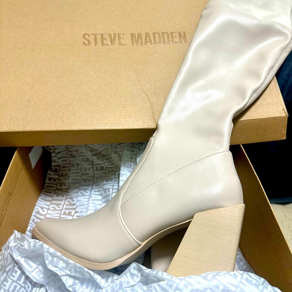 Never been worn Steve Madden knee high cream color boots.